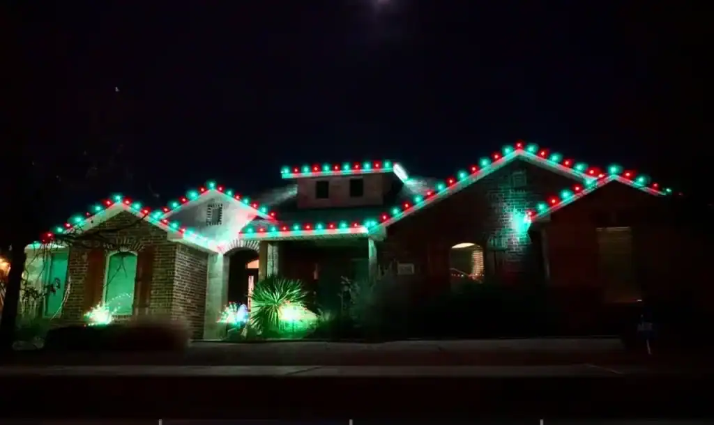 Bright colorful Christmas lights decorating a house